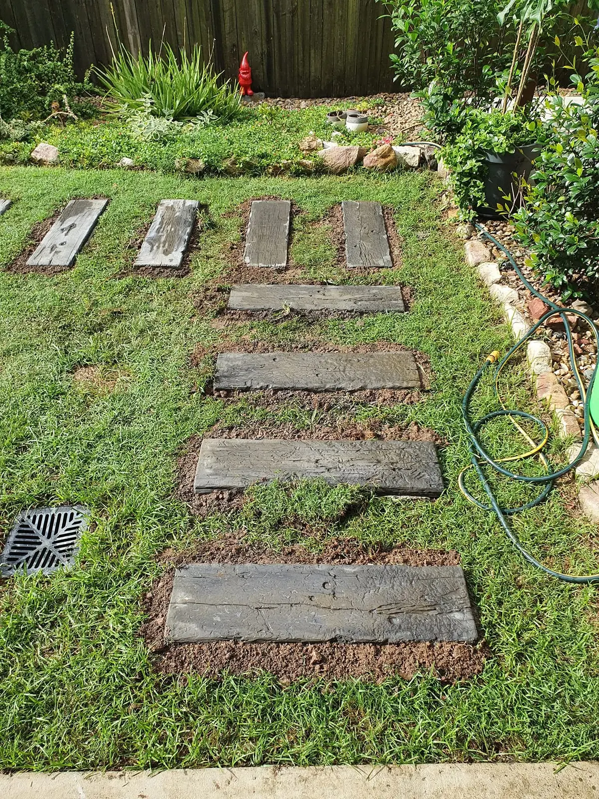 Timber garden steppers set in lawn — Bellbowrie