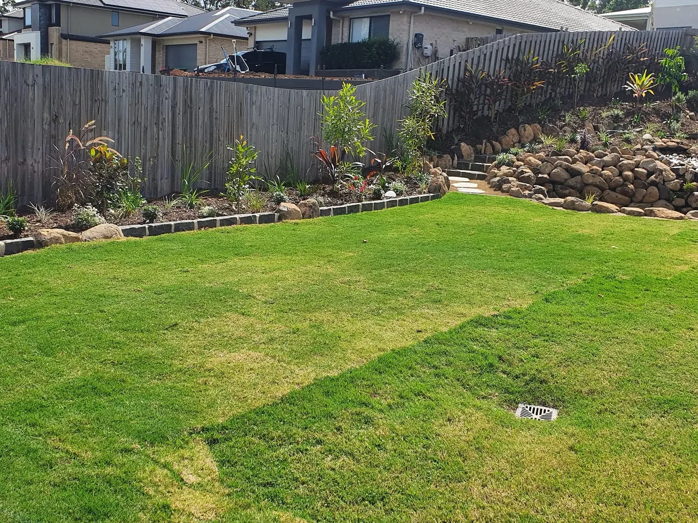 Pond integrated into backyard landscape
